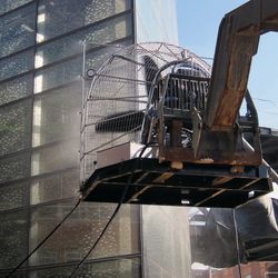 Large fan directed at building