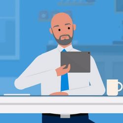 Cartoon of bald man with beard wearing office attire, looking at a tablet.