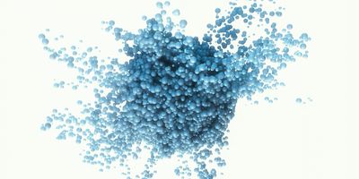 Computer image of blue spheres coming together on a white background