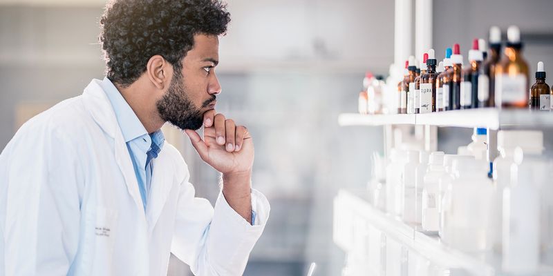 Scientist looks at reagent inventory